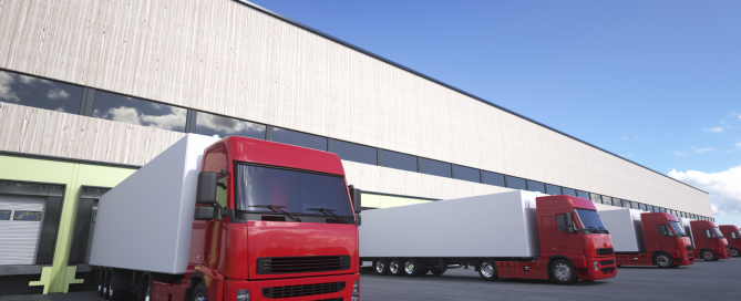 Unloading cargo from truck to warehouse.