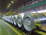 packed coils of steel sheet inside of plant