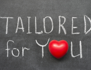 tailored for you phrase handwritten on blackboard with heart symbol instead of O