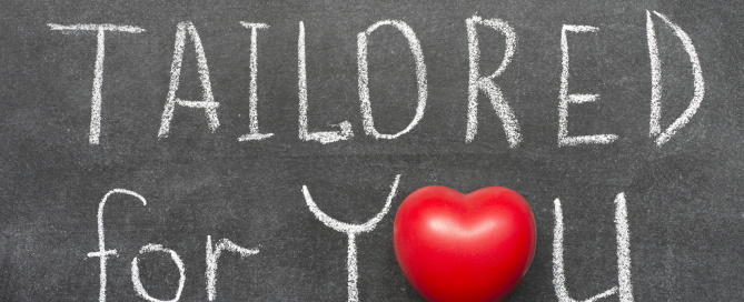 tailored for you phrase handwritten on blackboard with heart symbol instead of O